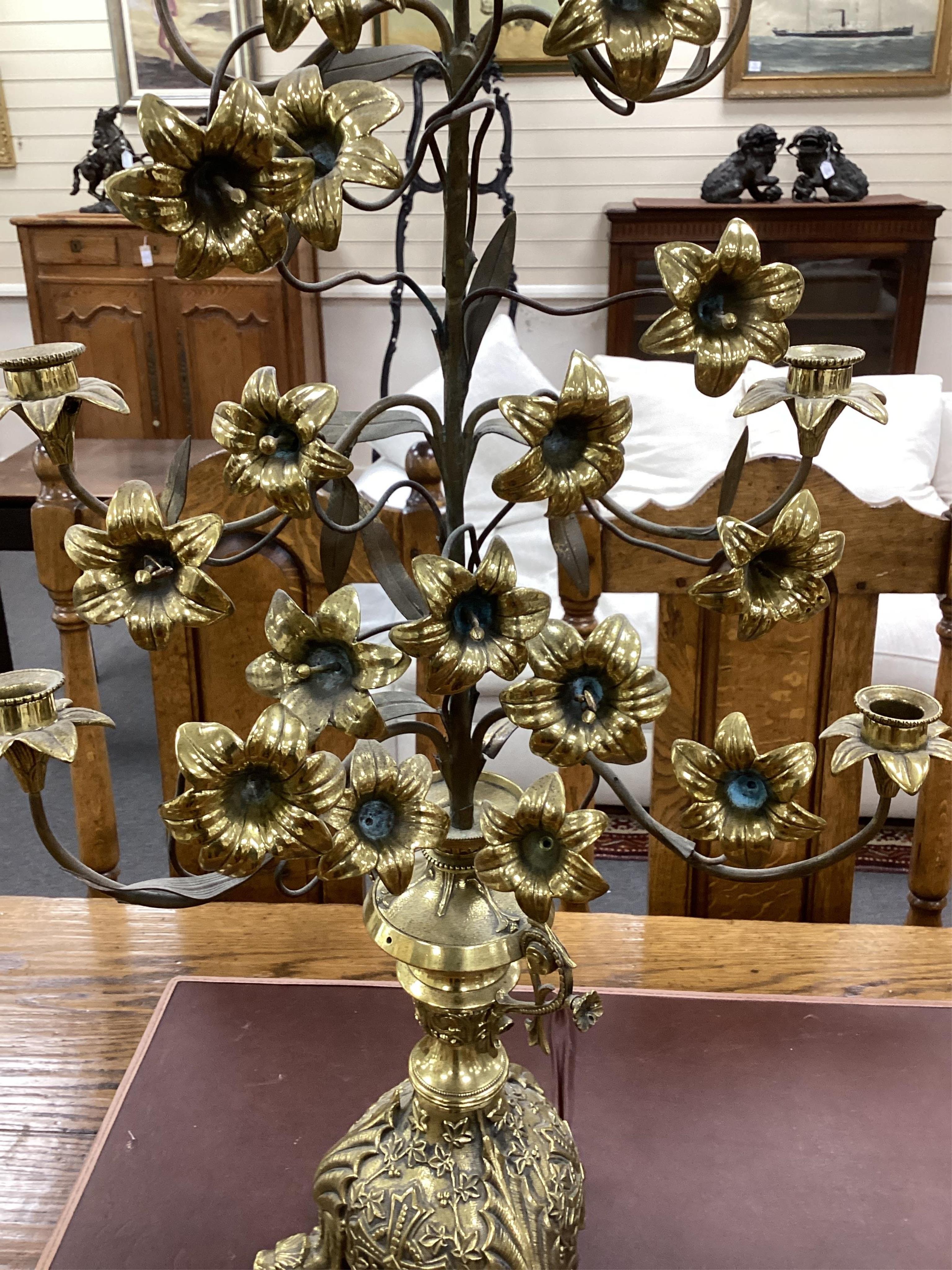 A pair of ornate French floral seven branch, brass church candelabra, 99cm high